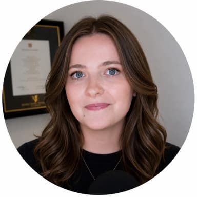 Professional headshot of Ellie Sleightholm, mathematician and online calculator developer, smiling in a clean office setting with neutral background